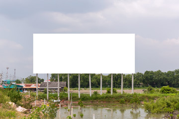 blank billboard on the sideway in the park. image for copy space, advertisement, text and object. white billboard in natural green.
