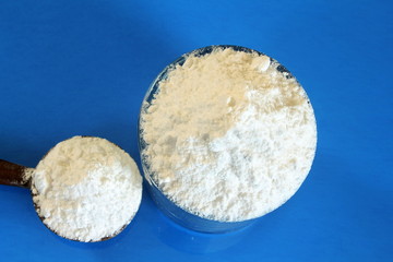 boric acid powder in spoon with boric powder topview