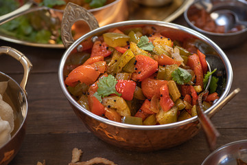 Vegan bell pepper curry in copper bowl