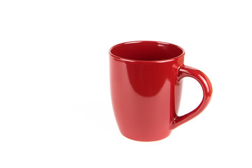 Red ceramic cup on a white background.
