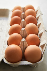 Brown eggs in carton