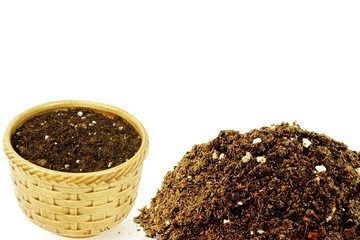 pot with organic potting soil on white background