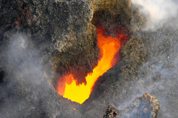 Glowing lava vent with visible volcano gasses - Big Island Hawaii