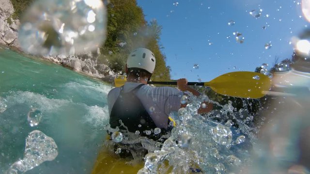 Slow-motion shot of a man kayaking
