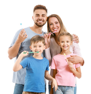 Portrait Of Family With Toothbrushes On White Background