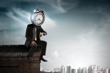 Fototapeta na wymiar Clock headed businessman. Business efficiency concept.
