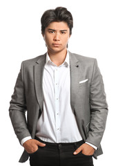 Portrait of handsome Asian businessman on white background