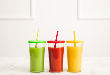 Glasses of fresh juice on table
