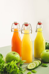 Bottles of fresh juice on table