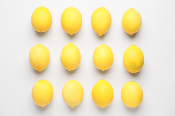 Ripe lemons on white background