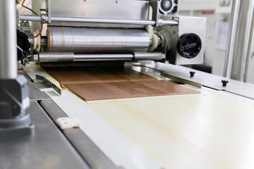 chocolate wafer pouring at a confectionery factory