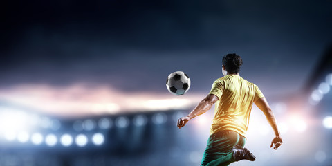 Fototapeta na wymiar Football player plays his best soccer match