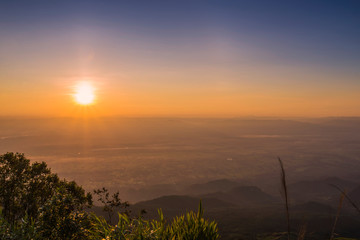 Landscape view of the sunrise Over field and tree foreground shadow defocused blur background