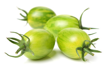 Green tomatoes on white background