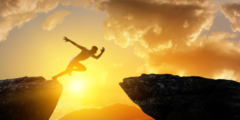 Man runner overcoming difficulty. Mixed media