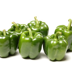 fresh green bell pepper (capsicum) on a white background