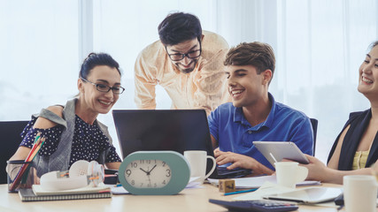 Group meeting of creative business people, designer and artist at office desk. Happy workplace and collaboration teamwork concept.
