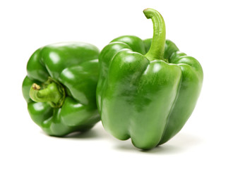 fresh green bell pepper (capsicum) on a white background