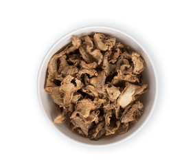 dried ginger in the white bowl isolated on white background, top view, flat lay