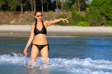 Obraz premium Woman with black bikini show beautiful
