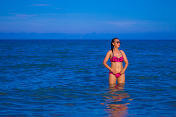 Woman shape sexy with bikini pink on beach