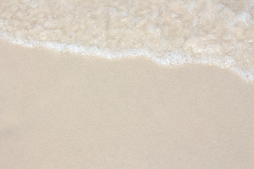Fototapeta na wymiar Ocean wave on sandy beach
