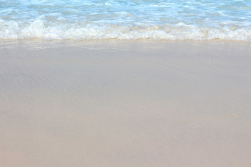 Fototapeta na wymiar Blue Sea waves on a sandy beach