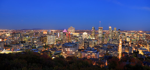 Montreal skyline illuminated at dusk, aerial view, Canada