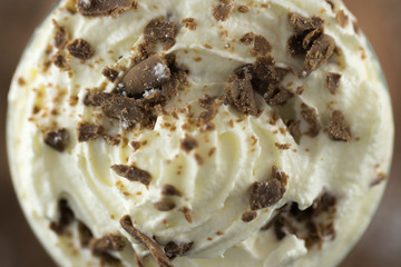 Top View Of Whipped Vanilla Ice Cream With Chocolate Flake Sprinkles Shot With A Macro Lens