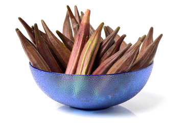 Red okra on white background