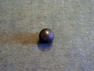 metal ball isolated on green background