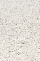 Footpath made of small white stones, background texture