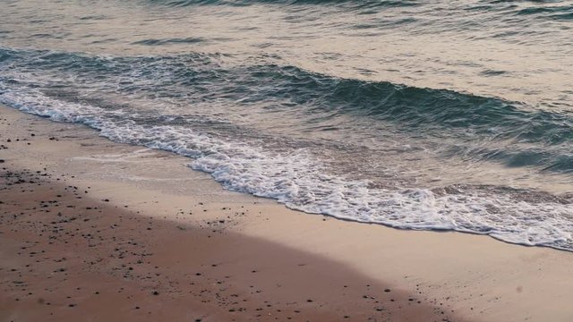 cinematic look tone. Beautiful tropical island paradise beach travel destination . Blue green ocean and clear sea beach in at the sunset . Bubbling wave coming from the sea sweeps the tranquil beach.