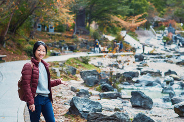 Asian girl is traveling at Sainokawara Park, hot spring garden, Kusatsu onsen, Japan
