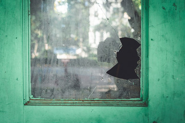 Old window with broken holes