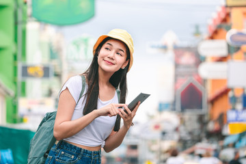 Traveler woman using mobile phone in bangkok city