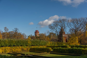 Obraz premium Famous tower and church at autumn on a hill in a park in Stockholm