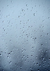 Rain drops on window glasses surface.