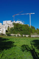 Reconstruction of the post-earthquake in Santo Stefano di Sessanio, L'Aquila, Abruzzo, Italy. You see the cranes that work