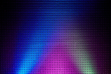 Bright intersecting rays of light of different colors