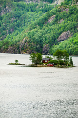 Fototapeta premium Fjord landscape with hytte on isle, Norway