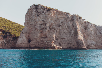 Fototapeta na wymiar View of coastline rocks with clear turquoise water