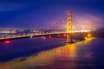 Golden gate bridge with warm light at dawn