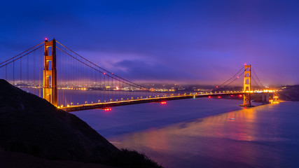 Golden gate bridge with warm light at dawn