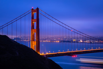 Golden gate bridge with warm light at dawn
