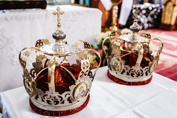 Wedding crowns. Wedding crown in church ready for marriage ceremony. close up. Divine Liturgy.