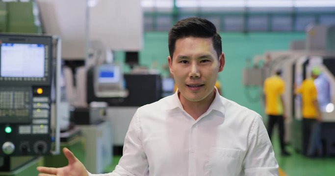 Business man speaking to camera at factory. Man was interview about his business.