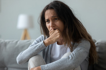 Frustrated young mixed race girl feeling desperately.