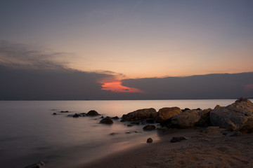 Fototapeta na wymiar sunset on the beach with long exposure