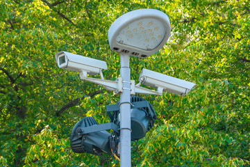 Pole with LED street lamp and two street surveillance cameras